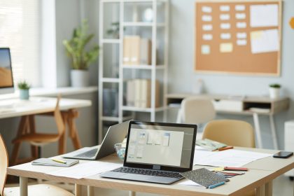Laptop On Desk in IT Office/seventyfourimages/Envato