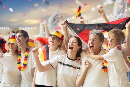Germany football supporter on stadium/FamVeld/Shutterstock