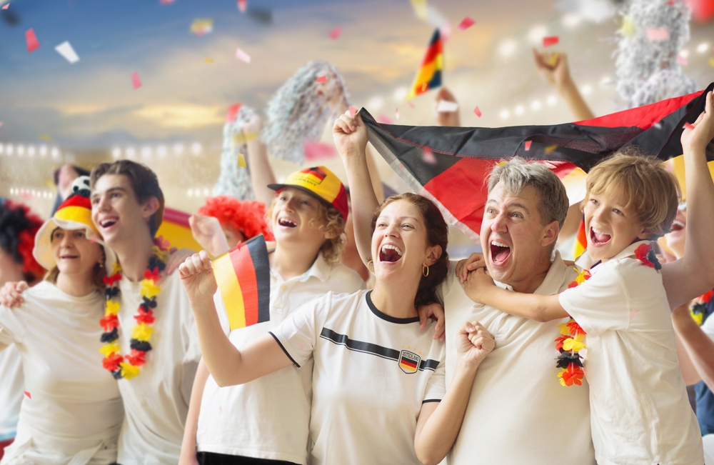 Germany football supporter on stadium/FamVeld/Shutterstock