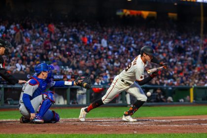 April 10, 2023 - San Francisco: San Francisco Giants outfielder Bryce Johnson bunts against the Los Angeles Dodgers at Oracle Park / Conor P. Fitzgerald / Shutterstock