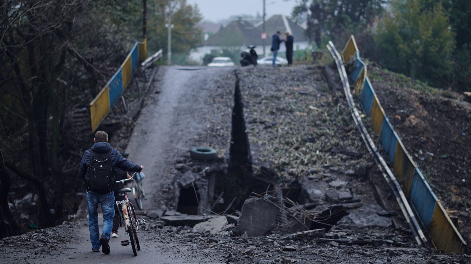 Balakliya, Ukraine - September 28th 2022 - citizens freely move on the city and use the destroyed bridge, after the liberation of the city from Russian occupation on September 8th, 2022 / Shutterstock