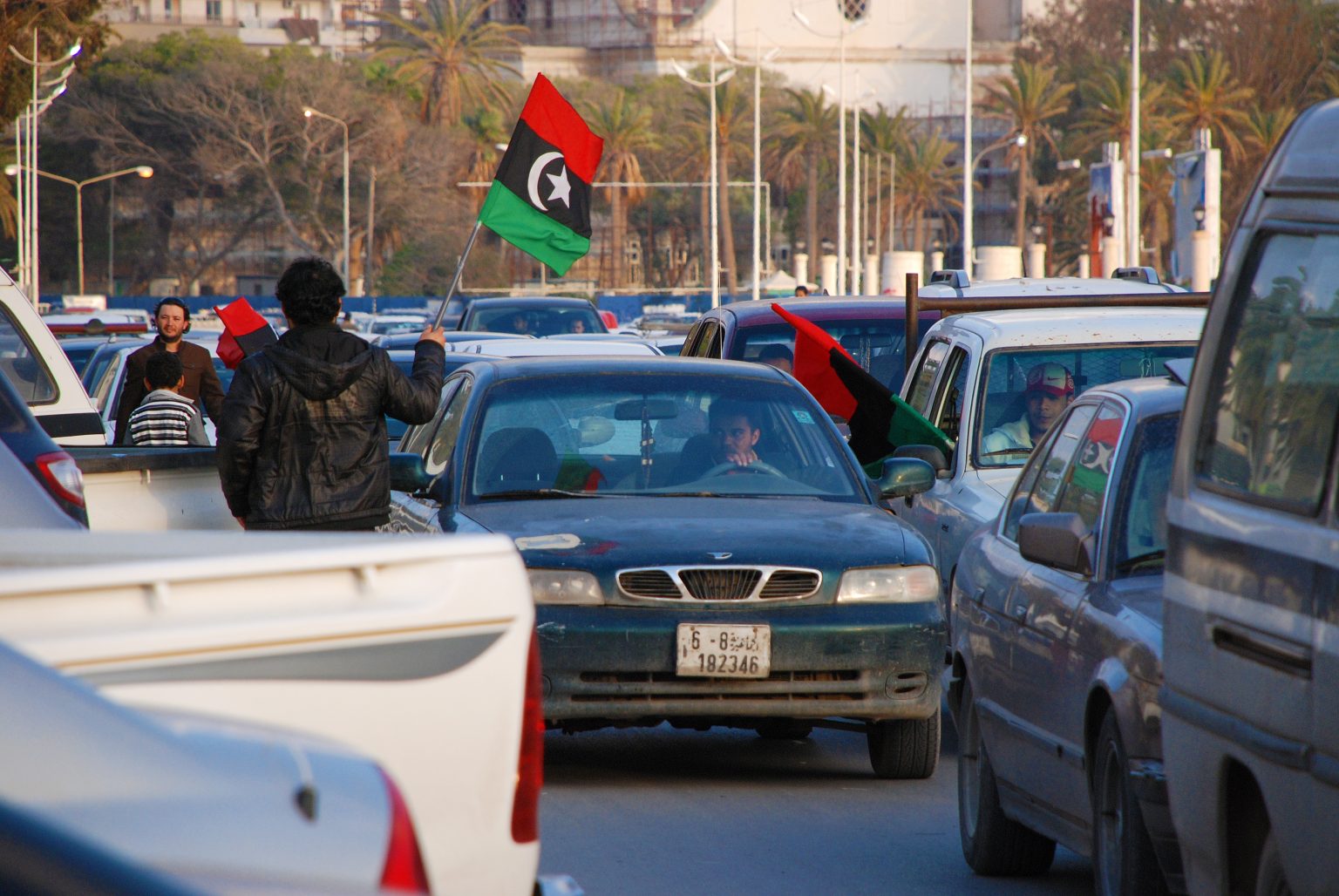 Citizens protest against the regime of Moammar Gaddafi. Automobile Flag Procession in Benghazi, Libya, April 6, 2011 / Rosen Ivanov Iliev / Shutterstock