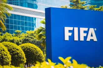 Fifa headquarters in Zurich, Switzerland, with the blue logo sign on a sunny day with green trees - New York City, 17 October 2025