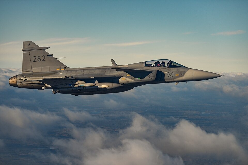 Swedish Saab JAS-39 Gripen fighter jet escorts/Wikimedia/U.S. Air Force photo by Tech. Sgt. Corban Lundborg