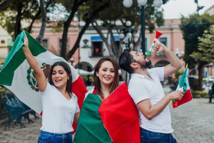 Celebrating with Flags and Horns in a City Square/Light-and-Vision/Envato