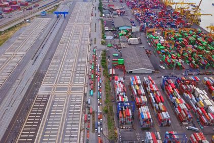 container cargo ship in the export and import business and logistics / Envato