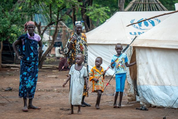 Refugees fled to Kule refugee camp in Ethiopia due to the clashes between South Sudanese government forces and South Sudan's former President Riek Machar's in Gambela, Ethiopia on July 15, 2014/Richard Juilliart/Shutterstock